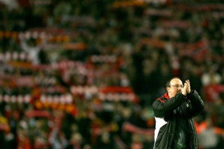 Rafa Benitez salutes the fans after the Arsenal victory