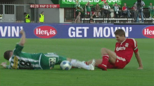 Gerrard, even without a boot on, flies in with the tackle