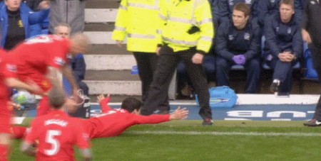 Suarez celebrates near the Everton dug out