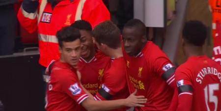 Raheem Sterling celebrates his second goal and Liverpool's 5th