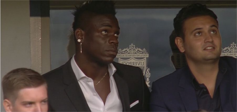 Mario Balotelli watches the game at Anfield