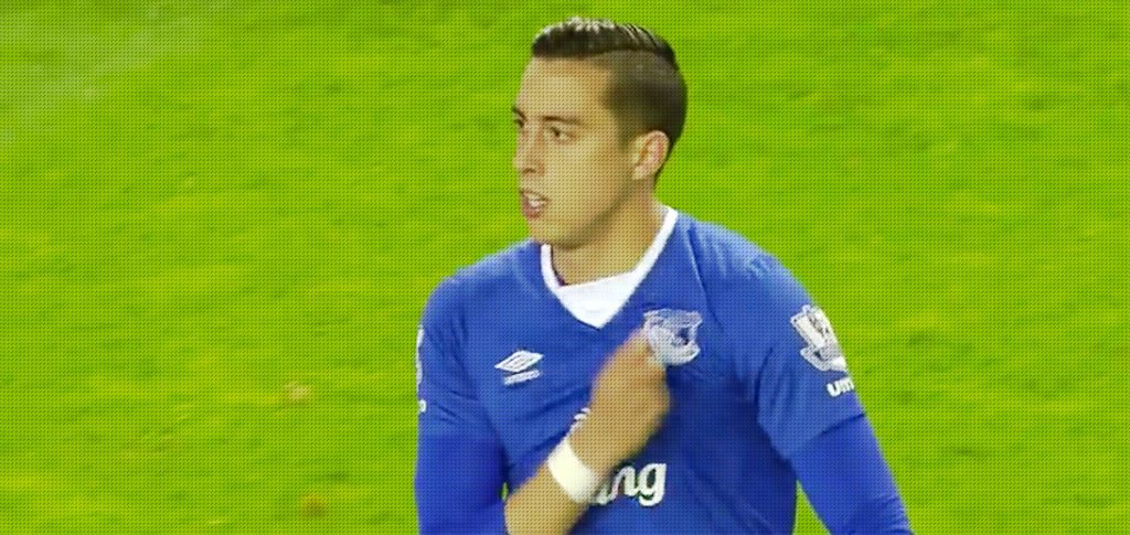 Funes Mori shows his badge to the Everton fans after he is sent off