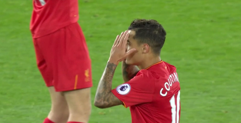 Coutinho sees a shot tipped wide by David De Gea