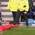 Suarez celebrates near the Everton dug out