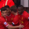 Raheem Sterling celebrates his second goal and Liverpool's 5th