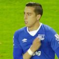 Funes Mori shows his badge to the Everton fans after he is sent off