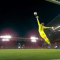 Curtis Jones beats the small outstretched arms of Jordan Pickford