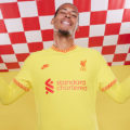 Virgil van Dijk shows off the new Liverpool kit